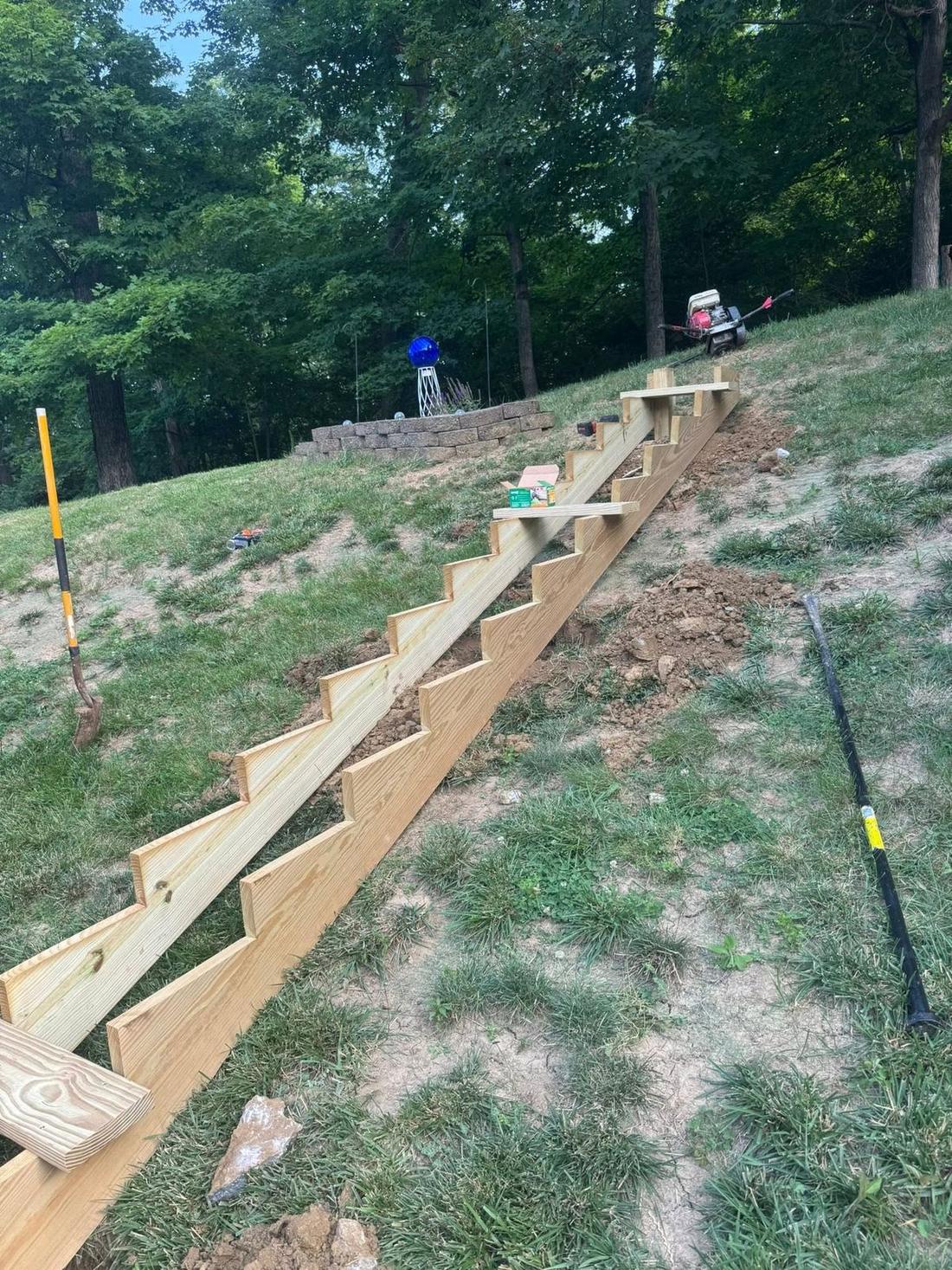 Timber retaining wall on a graded slope