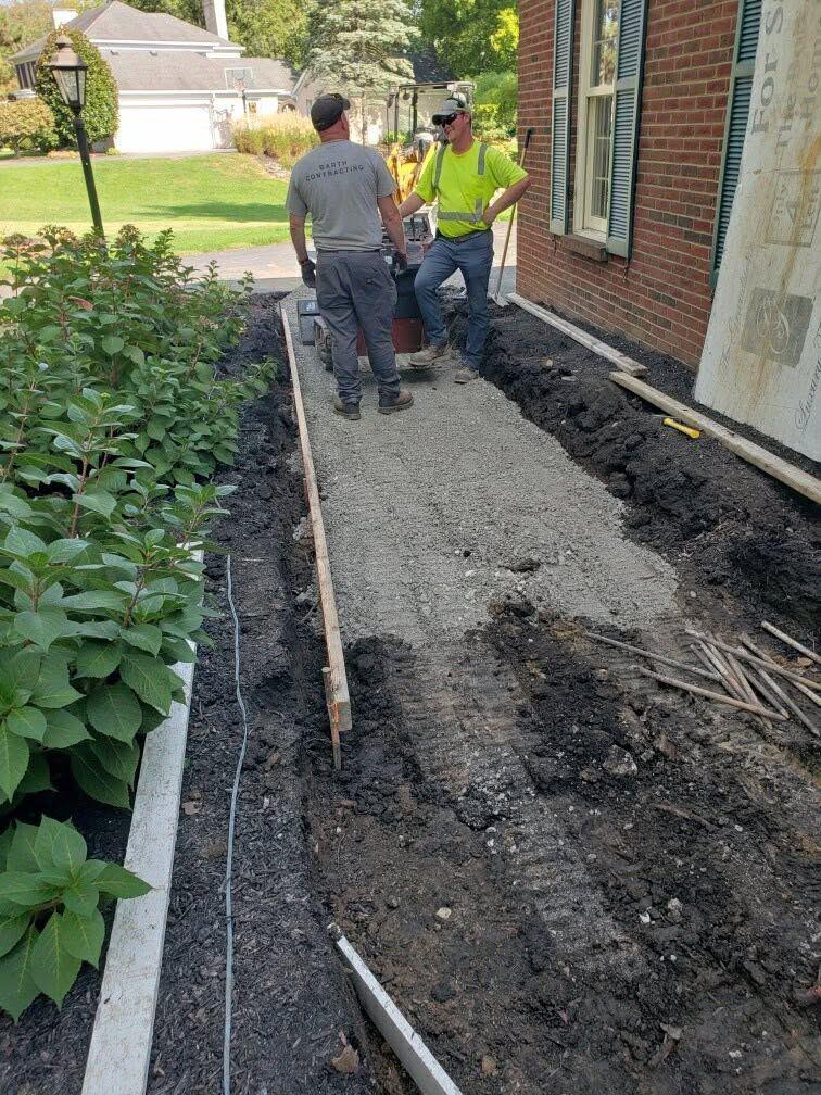 Trenching and base prep alongside the house